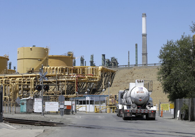 A truck drives into the Valero Benicia Refinery, Wednesday, July 12, 2017, in Benicia, Calif. California Gov. Jerry Brown is racing to convince lawmakers to extend the state's cap-and-trade program which puts a price on carbon emitted by polluters, including oil refineries. The program has been closely watched around the world as a market-based way to reduce greenhouse gas emissions, but it expires in 2020. (AP Photo/Rich Pedroncelli)