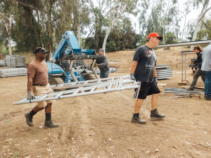 Donnie Williams (left) and Shawn Mckelvey working behind-the-scenes on Henry IV for the Shakespeare Center of Los Angeles.