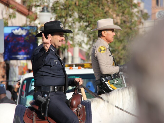 LAPD chief Charlie Beck and LA County Sheriff Lee Baca ride side by side in 125th Tournament of Roses Parade Presented by Honda on January 1, 2014 in Pasadena, California.