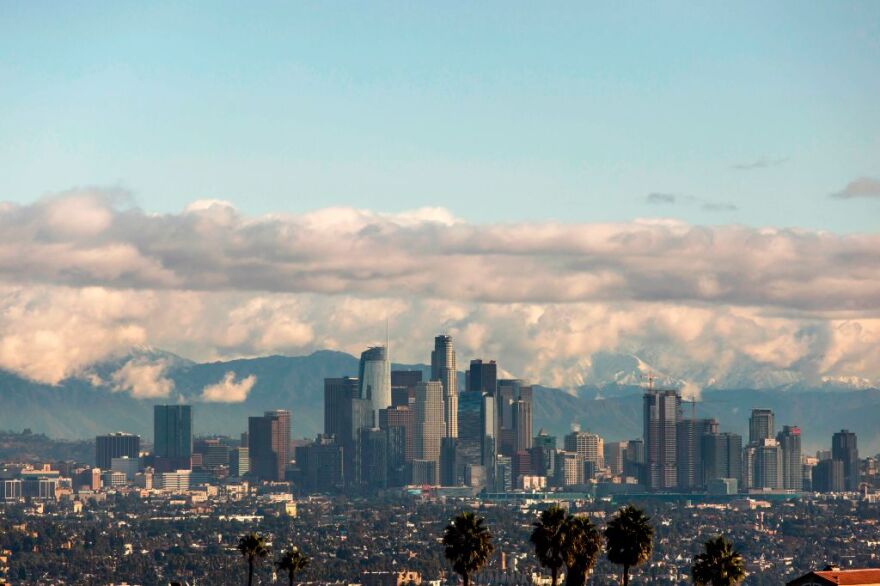 A view of the downtown Los Angeles skyline with the snow-covered San Gabriel Mountains in the background on November 29, 2019 in Los Angeles, California. - A new storm is forecast to sweep in from the west in the next several days, supercharged by an atmospheric river of subtropical moisture - long plumes of water vapor that can pour over from the Pacific Ocean through California. (Photo by Apu Gomes / AFP) (Photo by APU GOMES/AFP via Getty Images)