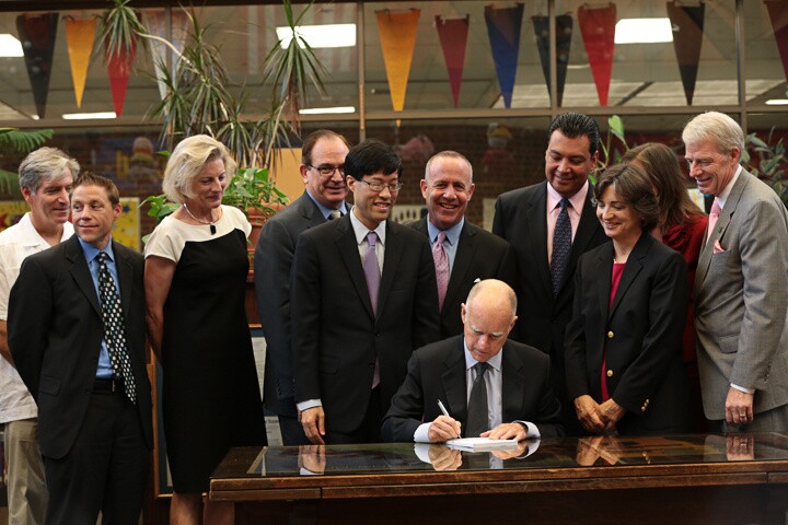 Gov. Jerry Brown signs funding legislation to assist disadvantage students and restore local control on spending in schools, during a ceremony at Cahuenga Elementary School on July 1, 2013.