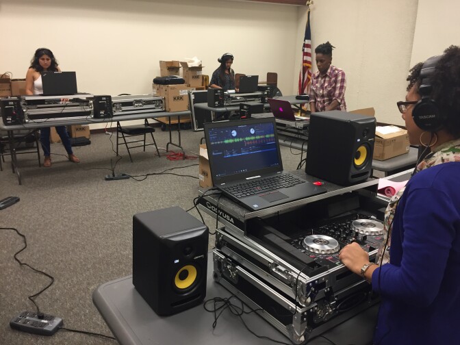 The young DJ's work on their mixes at the Compton public library.