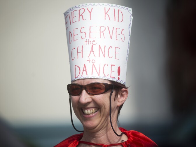 Dance teacher Ginger Fox dresses up in a hat and cape for a State of the Arts event on Wednesday, March 18, 2015 at Berendo Middle School. The event, hosted by Arts for LA, included a presentation of findings from a recent survey on the distribution of arts programs throughout the district.