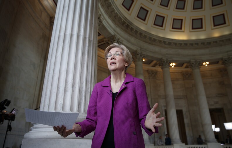 Holding a transcript of her speech in the Senate Chamber, Democratic Sen. Elizabeth Warren of Massachusetts reacts to being rebuked by the Senate leadership and accused of impugning a fellow senator, Sen. Jeff Sessions, R-Ala., the attorney general nominee, on Capitol Hill in Washington, Wednesday, Feb. 8, 2017. Warren was barred from saying anything more on the Senate floor about Sessions after she quoted from an old letter from Martin Luther King Jr.'s widow about Sessions. (AP Photo/J. Scott Applewhite)