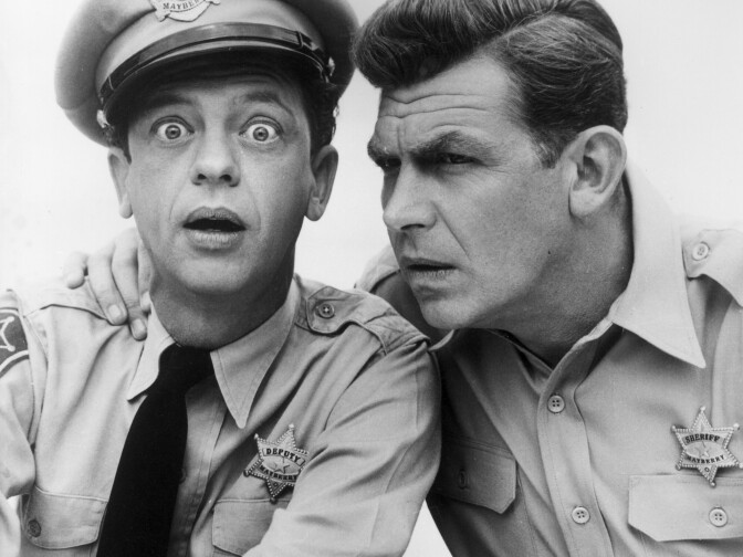 Don Knotts played bumbling Deputy Barney Fife to Griffith's Sheriff Andy Taylor on the sitcom <em>The Andy Griffith Show.</em>