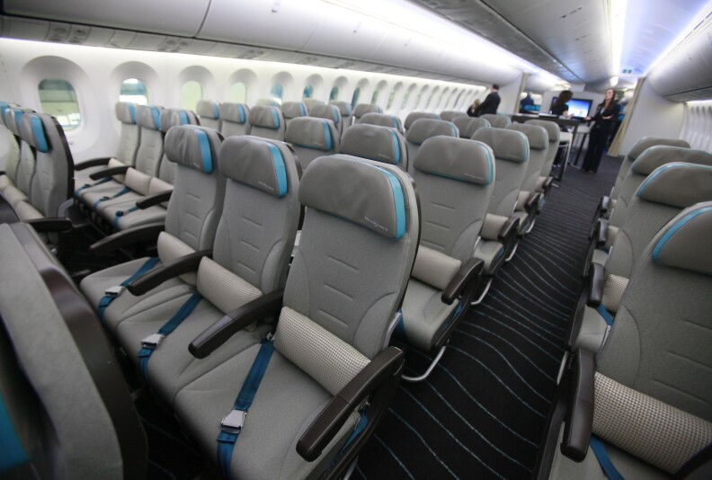 A picture shows the economy seating of the new Boeing 787 Dreamliner passenger jet at the Dublin International airport in Dublin, Ireland on January 26, 2012. As part of the Boeing 787 Dream Tour, Boeing brought the 787 Dreamliner to Dublin Airport to give key aviation finance leaders attending the 14th Annual European Airfinance Conference in Dublin the opportunity to see the airplane first hand.  AFP PHOTO / PETER MUHLY (Photo credit should read PETER MUHLY/AFP/Getty Images)