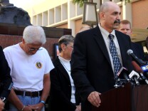 Joseph Bonaminio (l) the father of slain Riverside police officer Ryan Bomaminio and RPD detective Ron Sanfillipo at a news conference Wednesday. 