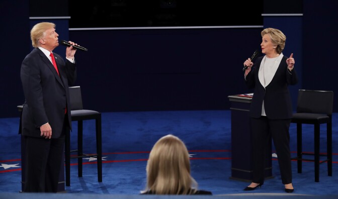 ST LOUIS, MO - OCTOBER 09:  Republican presidential nominee Donald Trump (L) and Democratic presidential nominee former Secretary of State Hillary Clinton speak during the town hall debate at Washington University on October 9, 2016 in St Louis, Missouri. This is the second of three presidential debates scheduled prior to the November 8th election.  (Photo by Chip Somodevilla/Getty Images)