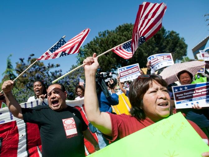 Axel Paredes, left, and Frieda Hinojosa of CHIRLA cheer as the march begins on Sepulveda Boulevard. Hundreds of immigration reform supporters took part in a march on Wednesday to Senator Diane Feinstein's LA office. The march coincides with a immigration reform rally in Washington D.C.