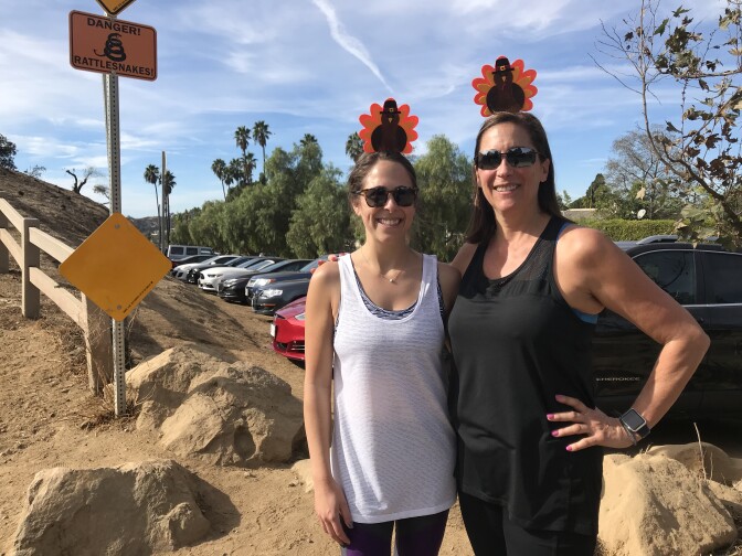 Robyn Rubin (left) and Debby Alberts during a Thanksgiving day hike at the Runyon hiking trails. Temperatures set records in Southern California for the warmest Thanksgiving holiday ever recorded.