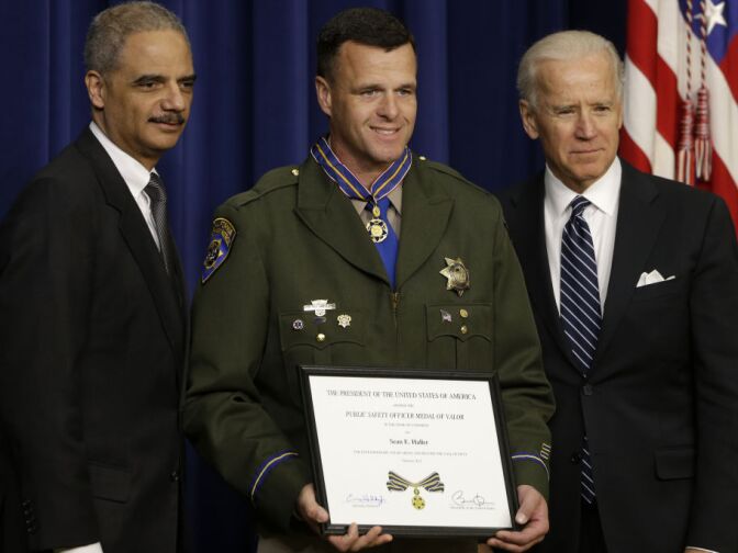 Vice President Joe Biden and Attorney General Eric Holder present the Medal of Valor Officer Sean Haller of the California Highway Patrol, Wednesday, Feb. 20, 2013, during a ceremony in the Eisenhower Executive Office Building on the White House complex in Washington. The medal is the highest national award for valor by a public safety officer. The medal is awarded to public safety officers who have exhibited exceptional courage, regardless of personal safety, in the attempt to save or protect human life.  