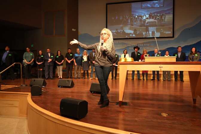 Dana Stangel, vice president of outreach for the Sunland-Tujunga Neighborhood Council, introduces the candidates at a forum for Los Angeles City Council District 7 at All Nations Church in Lake View Terrace on Feb. 11, 2017. 