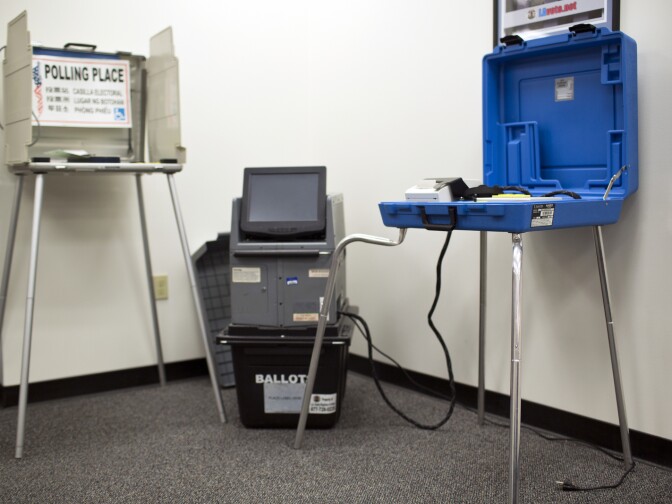 The current ballot marking device, left, ballot casting device and accessibility ballot marking device stand on display at the Los Angeles County Registrar-Recorder/County Clerk on Monday, Oct. 26, 2015. All three of these devices would be combined in the new touchscreen ballot device.