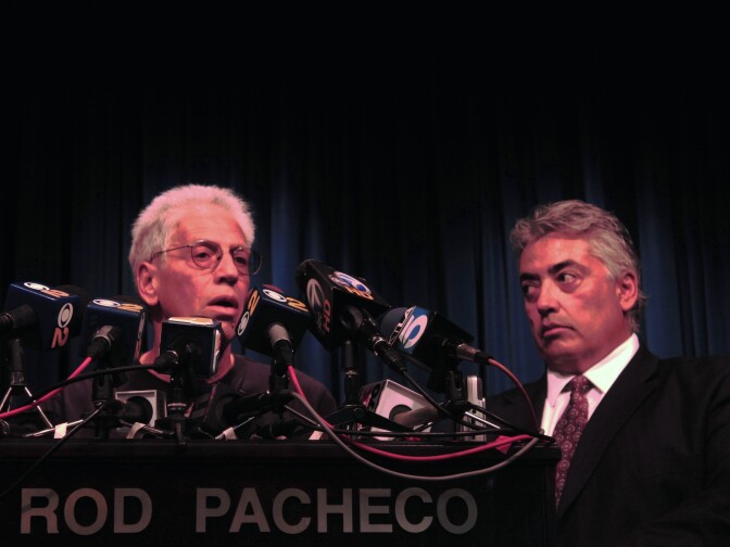 Joseph Bonaminio (left), the father of slain Riverside policeman Ryan Bonaminio, and Riverside County District Attorney Rod Pacheco announce the charges against suspected killer Earl Ellis Green at a Tuesday news conference. 