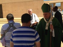 L.A. Archbishop Jose Gomez greets parishioners after a mass devoted to immigration reform September 8.