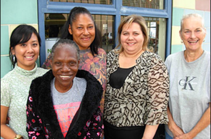 L-R: Downtown Women's Center volunteer Ivy Quicho, clients Fannie and Geraldine, executive director Lisa Watson, and tenant "Grandma" Connie Jacobs.