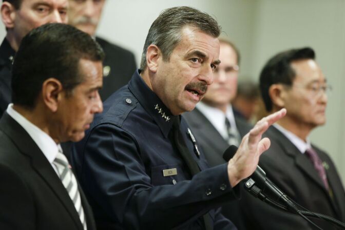 Los Angeles Police Chief Charlie Beck, center, talks about the $1 million reward for accused killer and fired Los Angeles police officer, Christopher Dorner as Los Angeles Mayor, Antonio Villaraigosa, left, and Irvine, Calif., Mayor Steven Choi look on during a new conference at the Los Angeles police department in Los Angeles, Sunday, Feb. 10, 2013. 