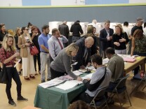 In this Nov. 8, 2016, file photo, people vote at a polling place set up at the Kenter Canyon Elementary School in Los Angeles. Tweets alone don’t make it true. Donald Trump won the presidency earlier this month even as he lost the popular vote to Democrat Hillary Clinton, according to The Associated Press’s vote-counting operation and election experts. Trump nonetheless tweeted on Nov. 26 that he won the popular vote. and alleged there was “serious voter fraud” in California, New Hampshire and Virginia. There’s no evidence to back up those claims. (AP Photo/Nick Ut, file)