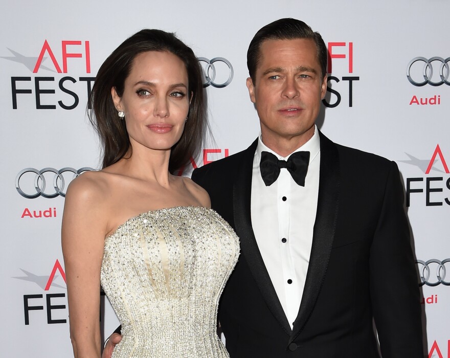 Writer-director-producer-actress Angelina Jolie Pitt (L) and actor-producer Brad Pitt arrive for the opening night gala premiere of Universal Pictures' 'By the Sea.'