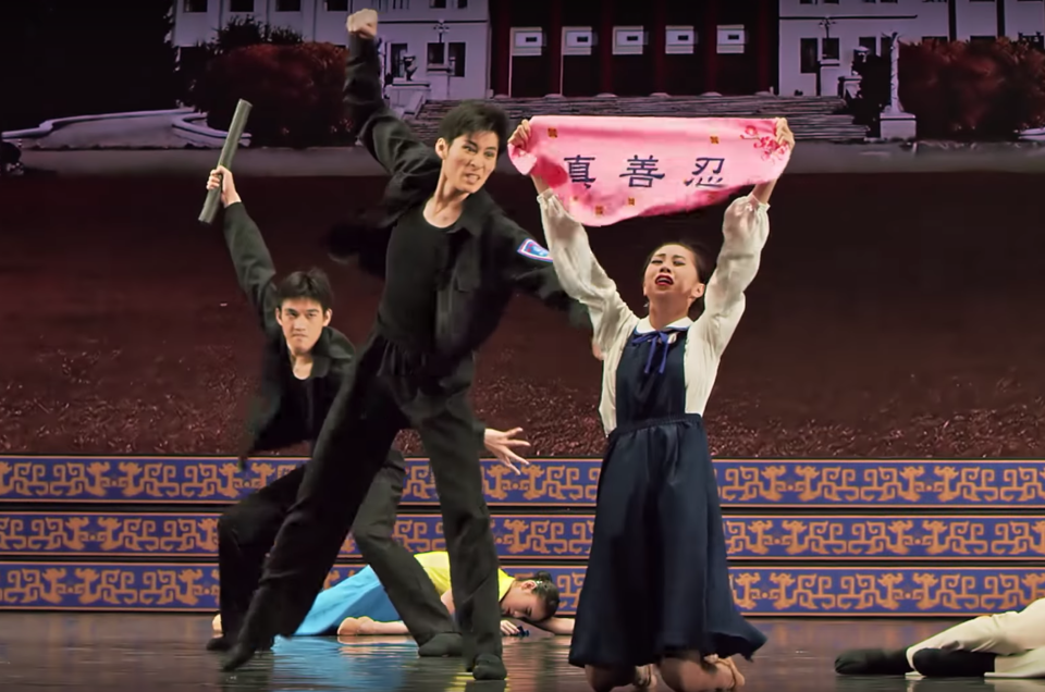 In this scene from a Shen Yun show, Communist thugs attack Falun Gong followers.