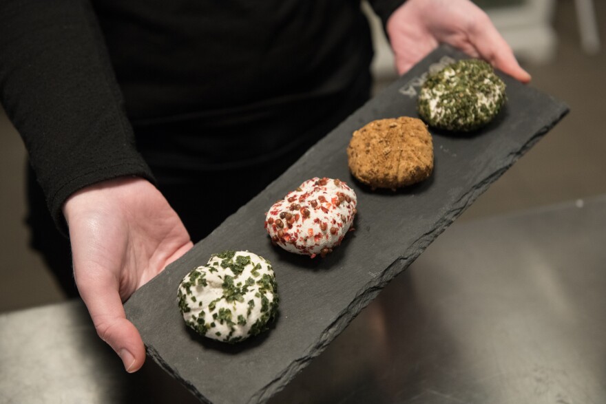 Anderson Santos displays vegan cheese products at his vegan dairy, Kojiterie, in Berlin, Germany on January 26, 2018.
