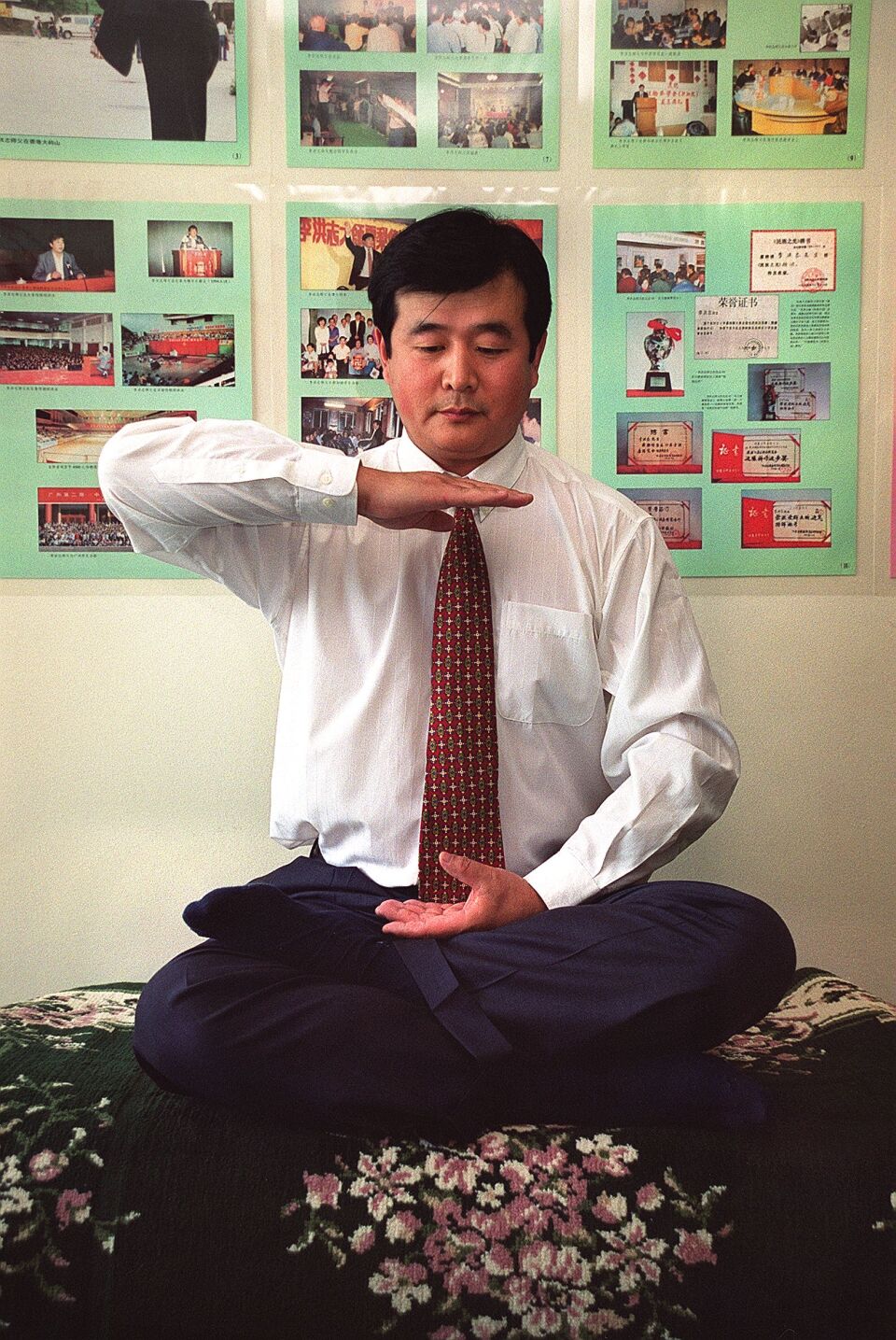 NEW YORK, NY - JUNE 15:  Falungong master Li Hongzhi, US-based leader of a popular meditation and martial arts sect, poses during an interview 15 June 1999 in New York. The group, claiming100 million followers, has drawn massive international attention since thousands of its members surrounded the Zhongnanhai leadership compound in Beijing in April.  (Photo credit should read HENNY ABRAMS/AFP/Getty Images)
