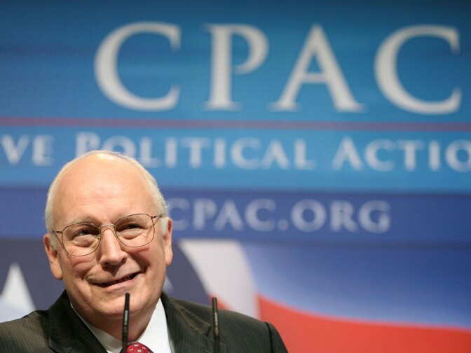 Dick Cheney on stage in front of a CPAC logo.
