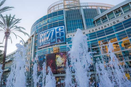 Exterior of the Anaheim Convention Center with water fountains in front with a marquee that reads BlizzCon.
