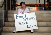 Members of Progressive Democrats of America and other activists hold a rally in front of Rep. Henry Waxman's office on June 17, 2013 in Los Angeles, California. The protestors were  asking the congressman to vote against a House farm bill that would reduce federal spending on the Supplemental Nutritional Assistance Program by $20.5 billion and affect food stamps and other services for the poor.   