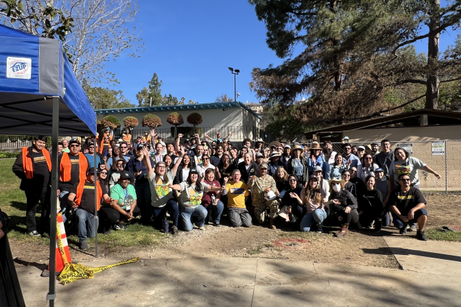 Volunteers at Alta Loma Park in Pasadena take a group photo before they go to their assigned tasks in the restoration process.