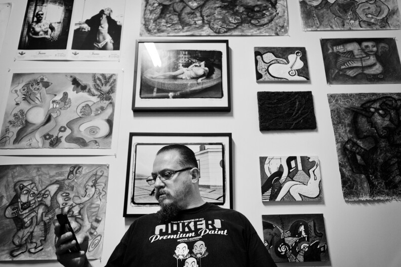 Estevan Oriol sits in his father's art space.