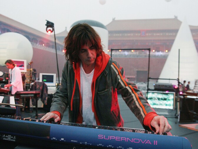 BEIJING, CHINA - OCTOBER 9:  Musical and light artist Jean-Michel Jarre rehearses ahead of his forthcoming concert in Beijing's Forbidden City, for the Official Launch of the "Year of France" festival, in the Forbidden City on October 9, 2004, in Beijing, China. The concert will be held on October 10 and Jean-Michel Jarre will perform in the Forbidden City with Francis Rimbert, accompanied by 2 guitarists, 85 members of the Beijing Symphony Orchestra, 72 members of the Chinese Nationasl Orchestra, a 72  member Chinese Choir and 100 Chinese people dressed in Traditional Costumes, adornned by Giant Inflatable projection Screens.  (Photo by Getty Images)