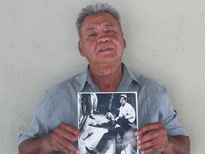 Juan Romero, 67, at his home in Modesto, Calif., holds a photo of himself and Sen. Robert F. Kennedy, taken by <em>The Los Angeles Times' </em>Boris Yaro on June 5, 1968.