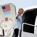 WHITE PLAINS, NY - SEPTEMBER 05:  Democratic presidential nominee former Secretary of State Hillary Clinton waves as she boards her new campaign plane at Westchester County Airport on September 5, 2016 in White Plains, New York. Clinton is kicking off a Labor Day campaign swing to Ohio and Iowa on a new campaign plane large enough to accomodate her traveling press corp.  (Photo by Justin Sullivan/Getty Images)