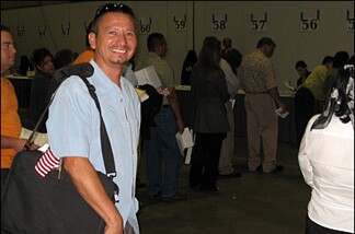 Jose Merino of El Salvador is among the last (in a group of 6,000 people) to recieve his certificate of citizenship. He says it's well-worth the wait.