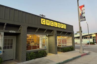 exterior of a building, with a sign that says "cyclops" in capital letters.