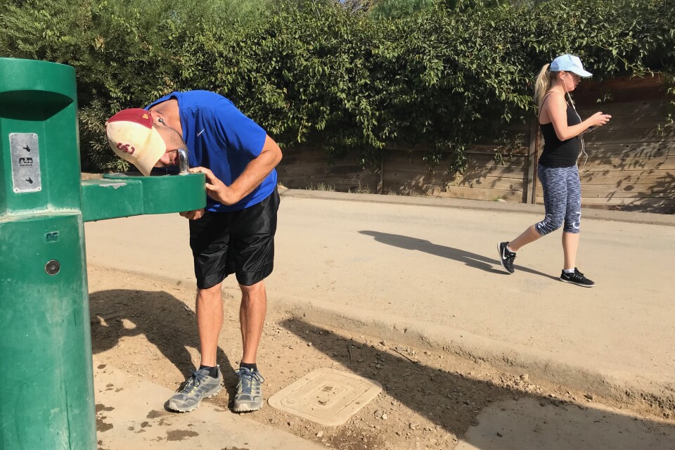 Hancock Park resident Ron Niv cools down at the Runyon hiking trails. Los Angeles beat the all-time record hitting 92 degrees on Thanksgiving day.