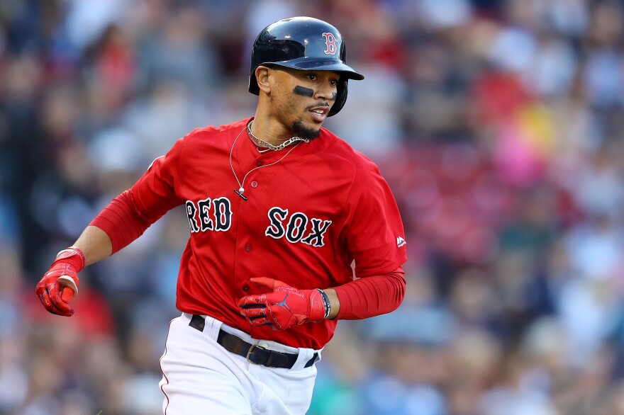 BOSTON, MASSACHUSETTS - SEPTEMBER 29: Mookie Betts #50 of the Boston Red Sox runs to first base during the fifth inning against the Baltimore Orioles at Fenway Park on September 29, 2019 in Boston, Massachusetts. (Photo by Maddie Meyer/Getty Images)