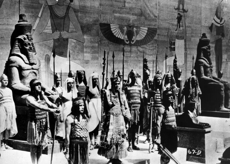 A scene from silent version of the 1923 epic film 'The Ten Commandments', also directed by Cecil B DeMille. The Egyptian Pharaoh is surrounded by his guards as he prepares to lead his army forth.  