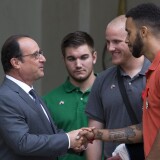 French President Francois Hollande (L) shakes hands with Anthony Sadler (R) next to off-duty US serviceman Spencer Stone (2nd R) and off-duty serviceman Alek Skarlatos after a reception at the Elysee Palace in Paris on August 24, 2015, during which they have been awarded with France's top Legion d'Honneur medal in recognition of their bravery after they overpowered the train attacker. AFP PHOTO / KENZO TRIBOUILLARD        (Photo credit should read KENZO TRIBOUILLARD/AFP/Getty Images)