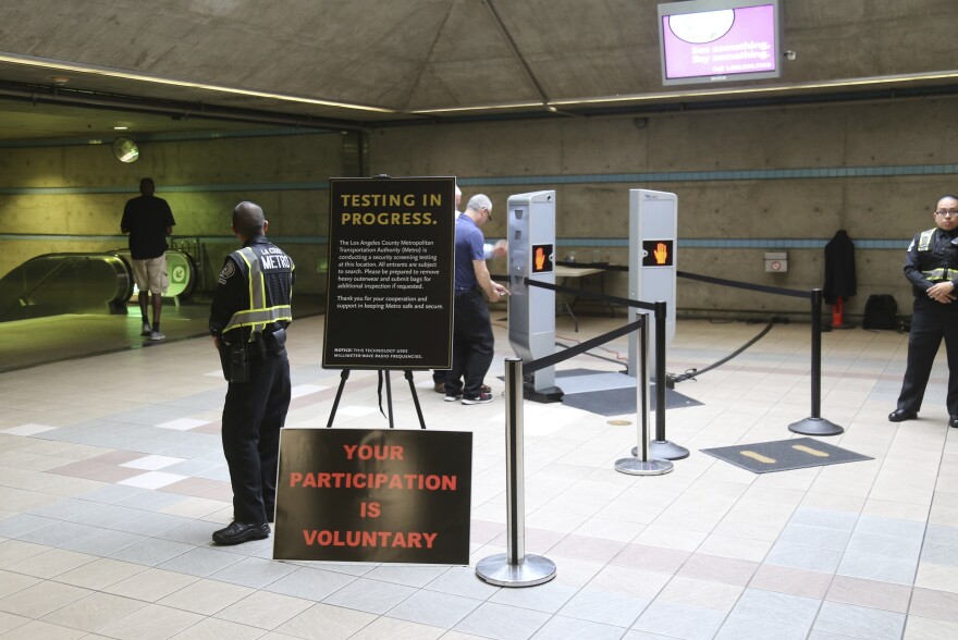Los Angeles Metropolitan Transportation Authority, Metro hold a two-day pilot program of new body scanner at Union Station in Los Angeles Wednesday, Aug. 16, 2017. Passengers boarding subway trains in Los Angeles may soon be shuffled through airport-style body scanners that are aimed to detect firearms and explosives. Officials say the machines can scan about 600 people per hour. (AP Photo/Mike Balsamo)