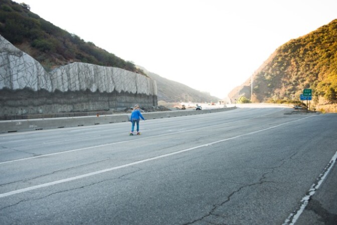 Skateboarder Cindy Whitehead breezes down the 405 Freeway during Carmageddon II.