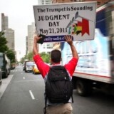 Participants in a movement that is proselytizing that the world will end this May 21, Judgment Day, walk down the middle of the street on May 13, 2011 in New York City.