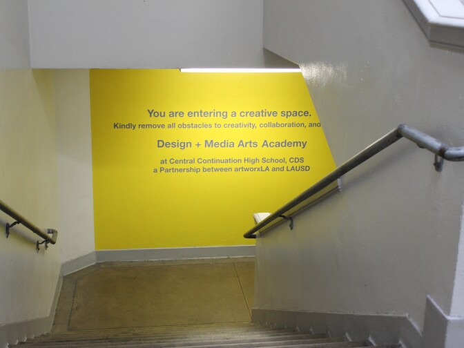 17-year-old Lamar Outlaw says the newly painted hallways, featuring bright colors, make him feel more comfortable at his high school. 