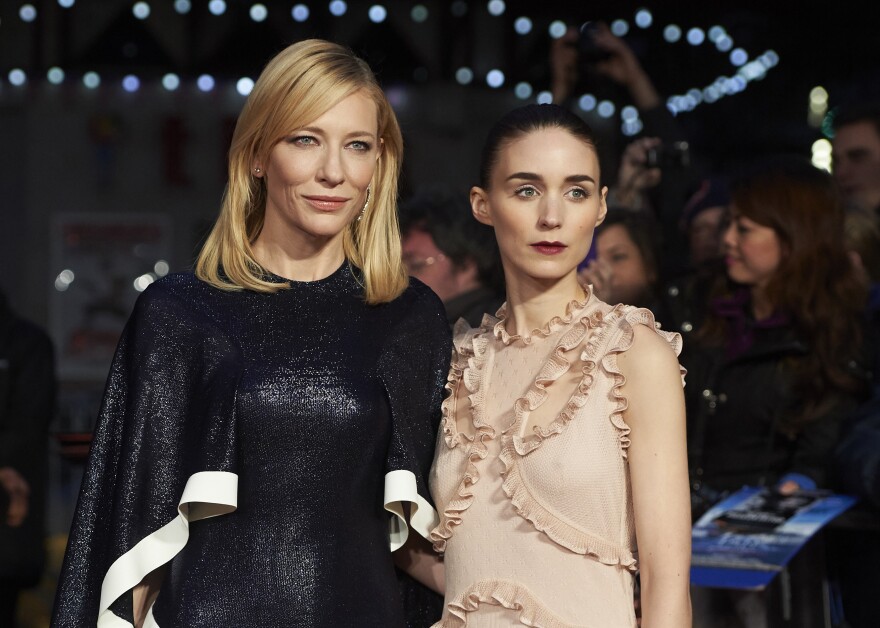 Australian actress Cate Blanchett (L) and US actress Rooney Mara pose on arrival for a gala screening of the movie "Carol." 