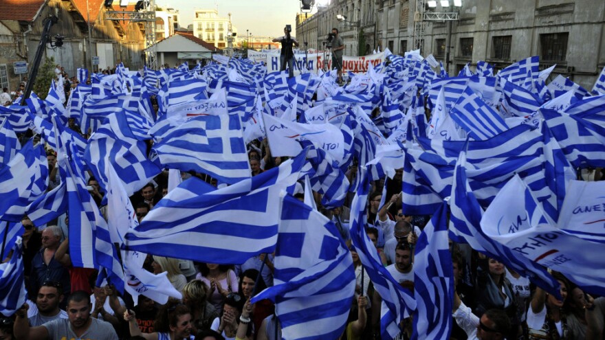 Supporters of the right-wing splinter Independent Greeks party wave flags during an election rally in the northern Greek city of Thessaloniki, May 2, 2012. Panos Kammenos' party and other anti-bailout parties have made a strong showing in opinion polls ahead of the May 6 general election.
