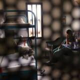 Immigrants sit in their housing cell in the women's wing of the detention facility for illegal immigrants on July 30, 2010 in Eloy, Arizona.  Arizona, which deports and returns more illegal immigrants than any other state, is currently appealing a judge's ruling suspending controversial provisions of Arizona's immigration enforcement law SB 1070.