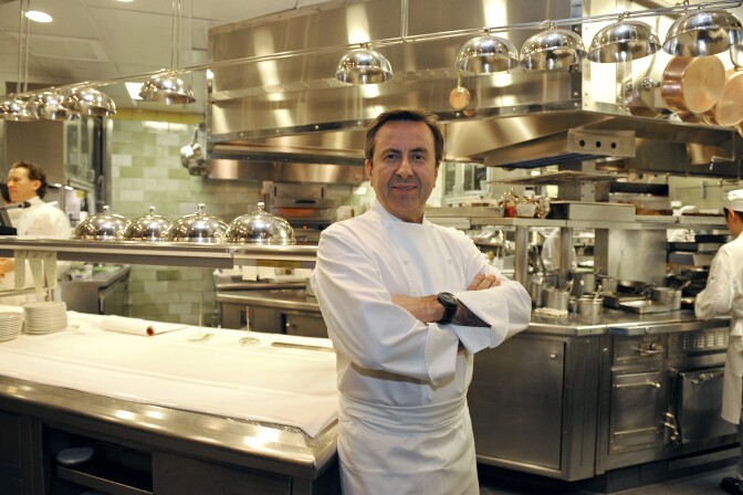French chef Daniel Boulud poses in the kitchen at his flagship restaurant “Daniel” in New York, October 27, 2009. The fifth annual edition of the Michelin dining guide for New York has anointed a new three star restaurant, awarding its highest honor to Boulud for his eatery “Daniel”. Boulud joins two other Frenchman with three star-rated New York restaurants, Jean-Georges Vongerichten for "Jean-Georges" and Eric Ripert for "Le Bernardin." Rounding out the city's list of three star-rated establishments are Japanese restaurant "Masa", owned by Masa Takayama, and "Per Se", owned by California chef Thomas Keller. AFP PHOTO/Emmanuel Dunand (Photo credit should read EMMANUEL DUNAND/AFP/Getty Images)