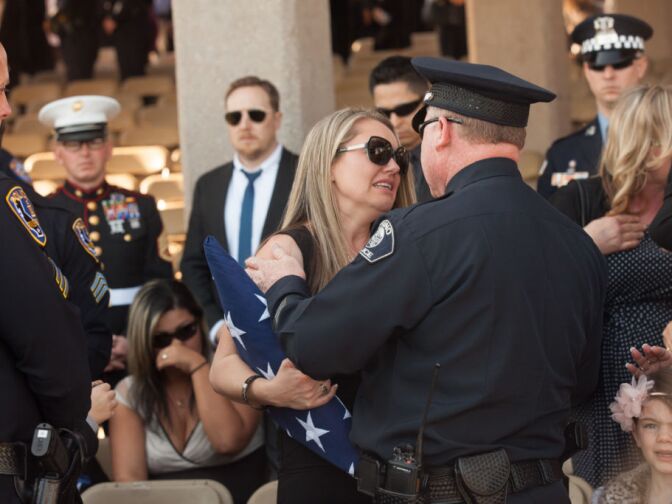 Michael Crain's wife Regina mourns this loss of her husband who was ambushed by Christopher Dorner in Riverside.