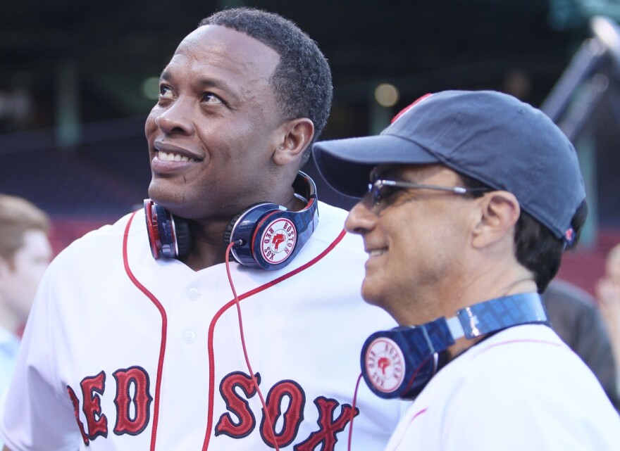 Producer and musician Dr. Dre and Interscope and Geffen Records chairman Jimmy Iovine are on the field before the Boston Red Sox take on the the New York Yankees on April 4, 2010 during Opening Night at Fenway Park in Boston, Massachusetts.